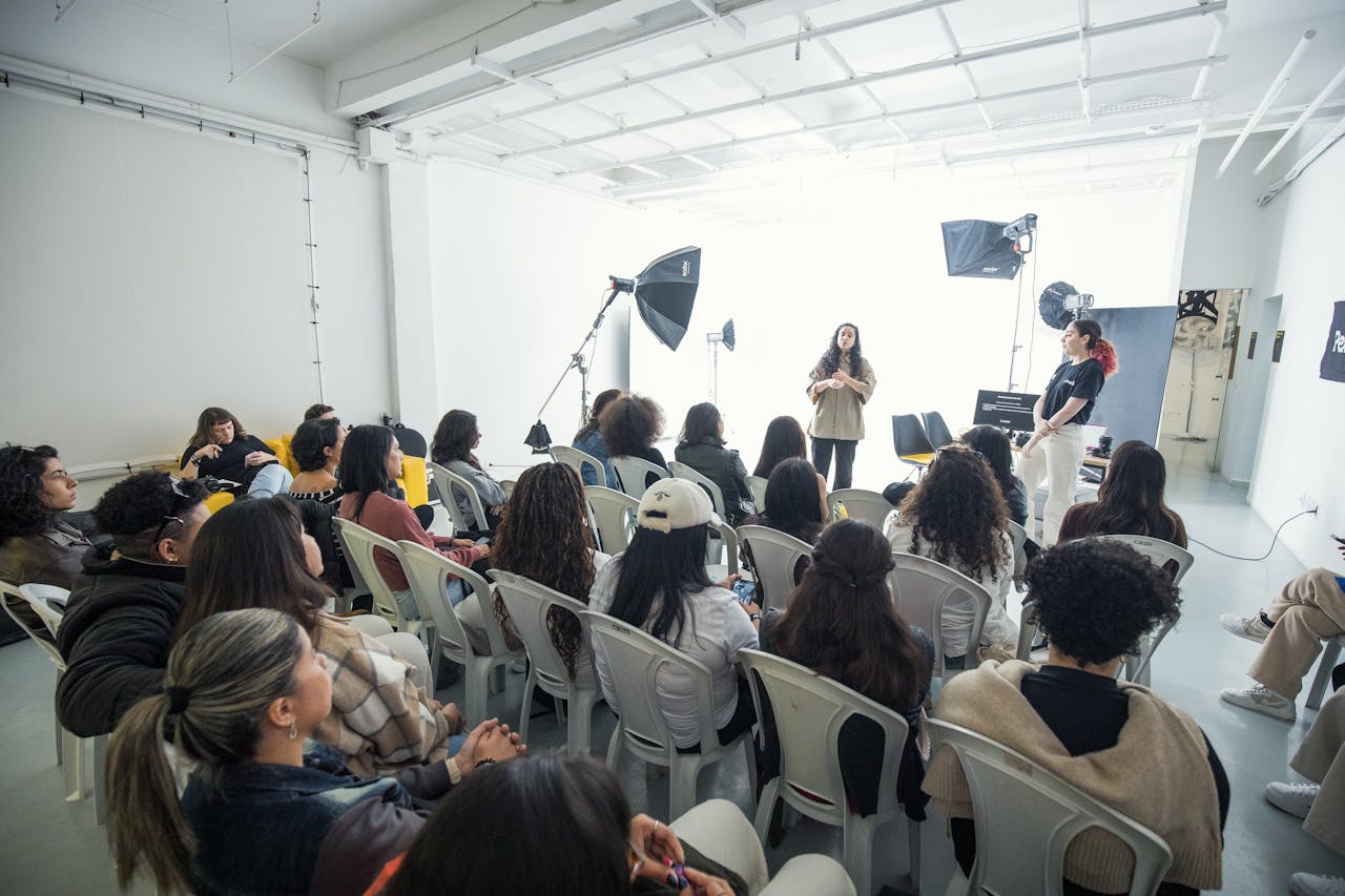 services-03 Captivating group workshop in a bright photography studio with diverse participants.